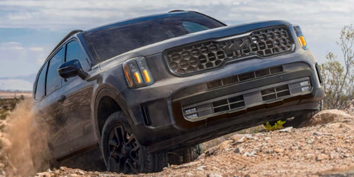 The 2025 Kia Telluride driving on a dust bank